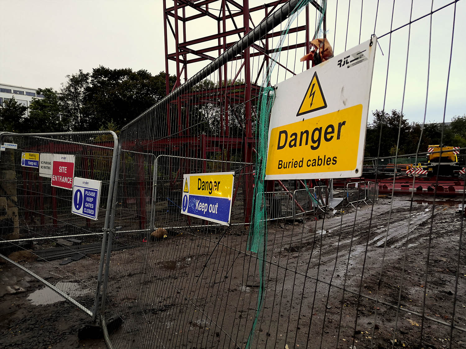 Hazard and warning signs on construction site for new buildings in the UK